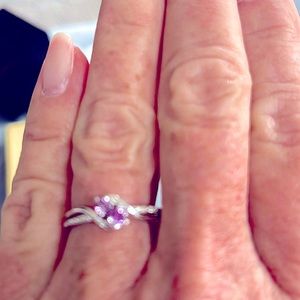 10K White Gold with 2 Amethyst stones and diamonds on band. Great holiday gift.